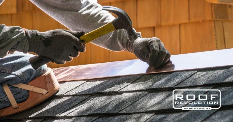 Roofer installing copper flashing